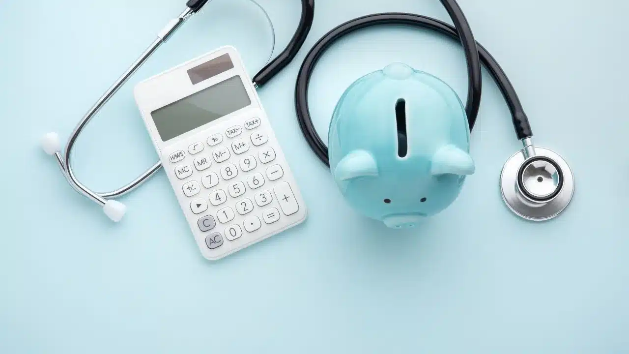 Health insurance, tax concept on blue background Health insurance, tax concept on blue background