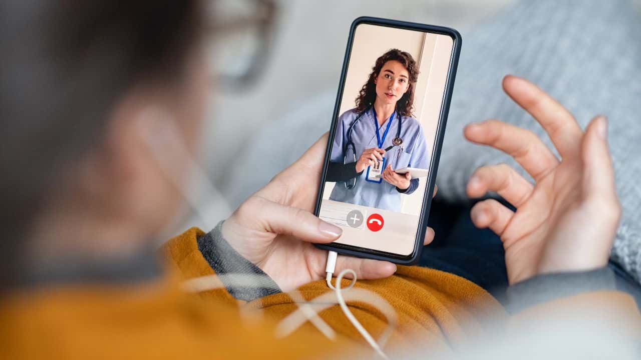 Woman doing video call with doctor Woman doing video call with doctor